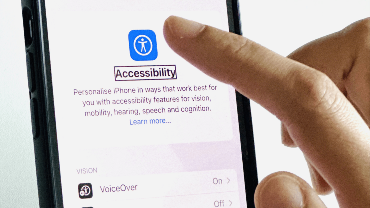 Person discovering accessibility options on mobile phone